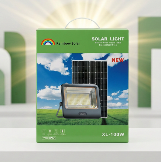 Rainbow Solar brand XL-100W solar light package box, featuring a green design with an illustration of a solar panel and light fixture against a blue sky and green grass, set against a stylized white and green background with a sunburst effect.