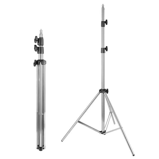 A silver metal studio light stand shown in two positions: folded on the left and fully extended on the right, against a plain white background.